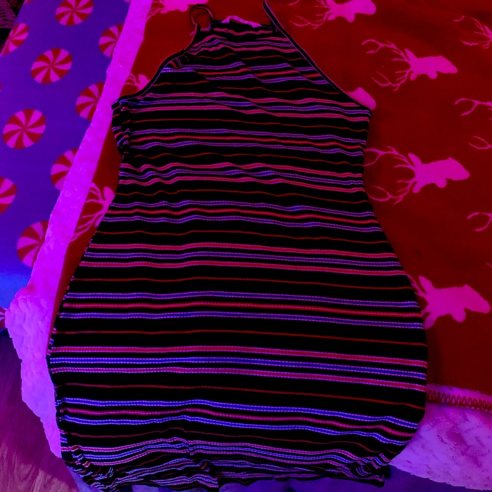 tight fitting dress with spaghetti strap sleeves.